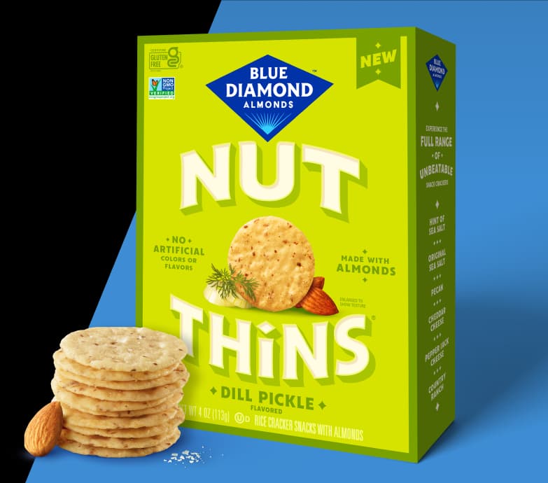 Nut-Thins Dill PIckle packing next to stack of crackers