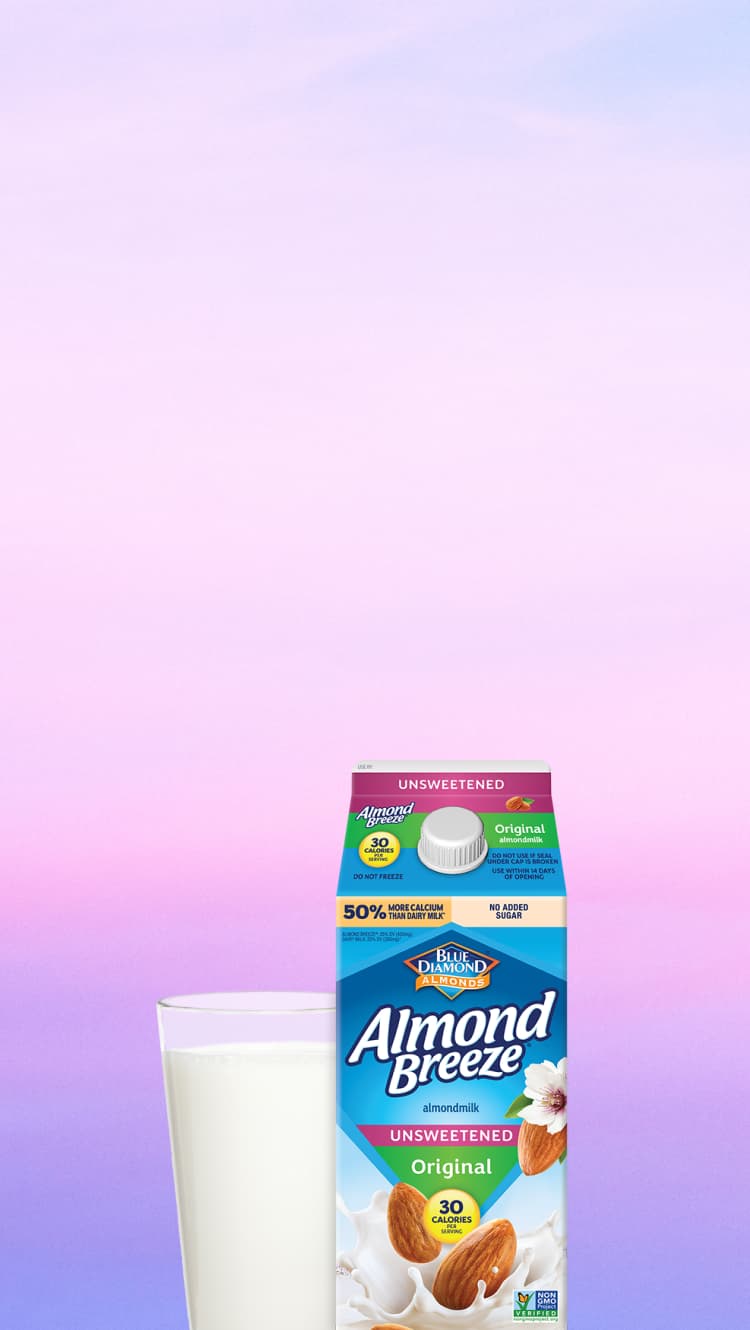 Glass of Almond Breeze almond milk and carton