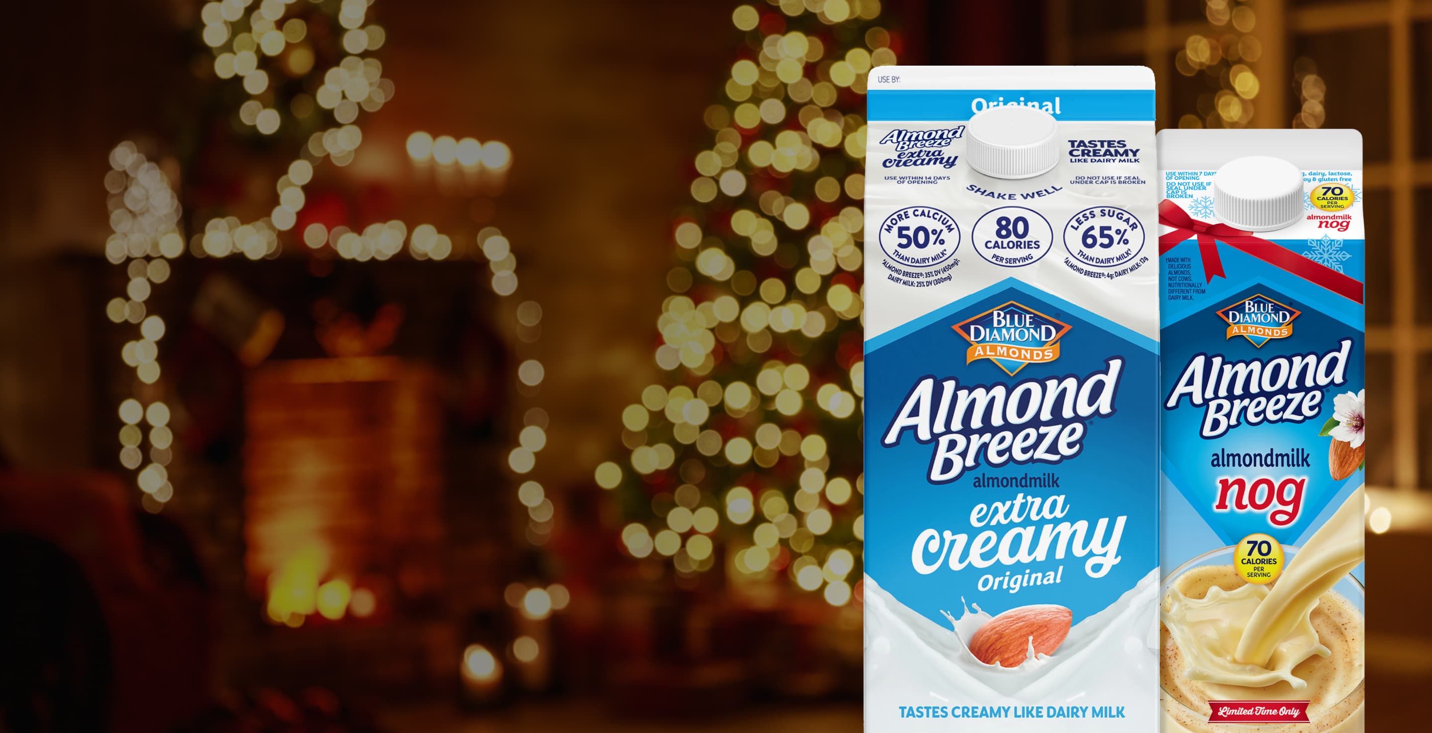 Almond Breeze cartons in front of a Christmas tree and fireplace