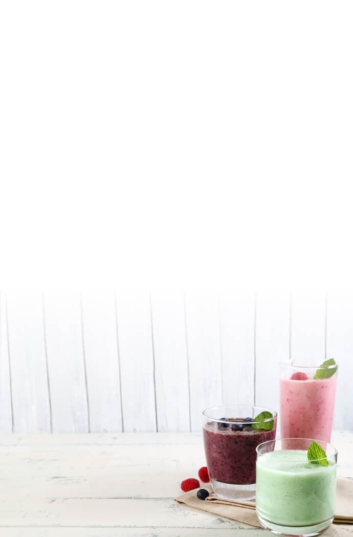 A variety of smoothies sitting on a table