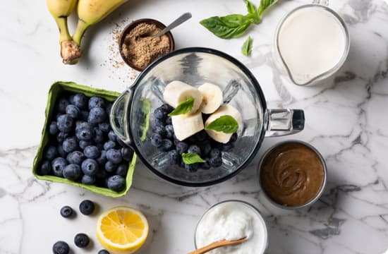 Ingredients being prepared to make an Almond Breeze Almonmilk smoothie.