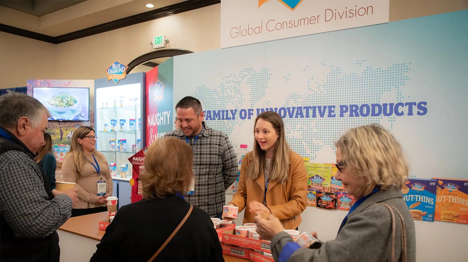 Employees handing out almond cans