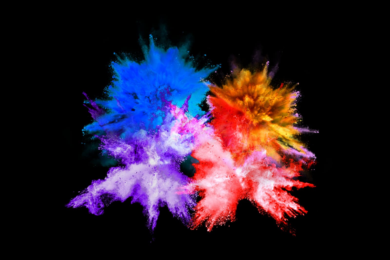 Bursts of different colored powders, capturing a moment of movement and energy.