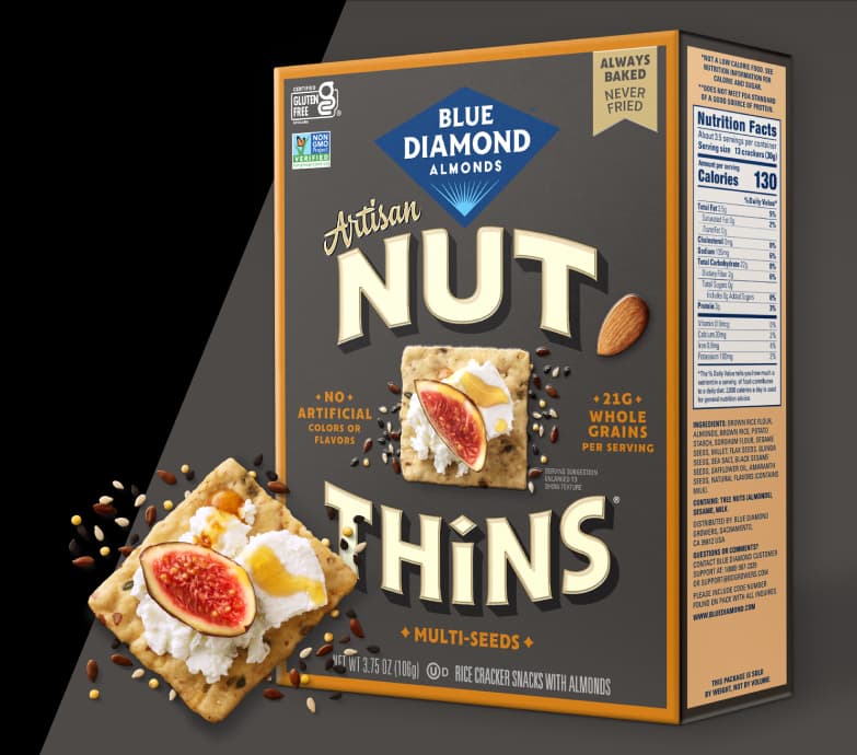 Nut-Thins artisan multi-seeds packing next to stack of crackers
