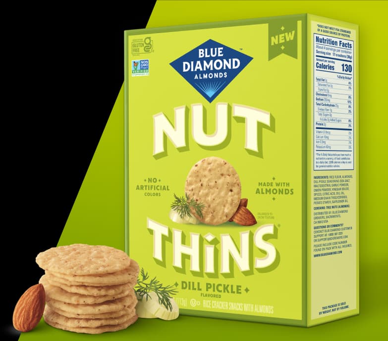 Nut-Thins Dill PIckle packing next to stack of crackers